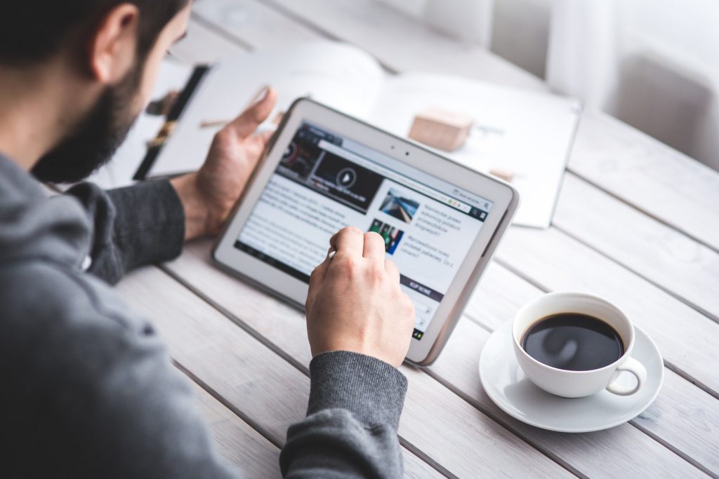 Man looking at video on tablet