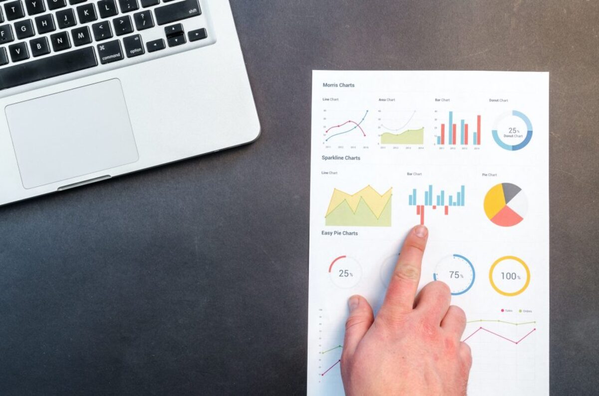 Person analyzing printed chart