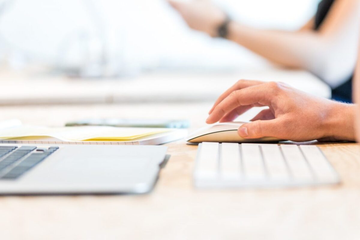 Person clicking with computer mouse