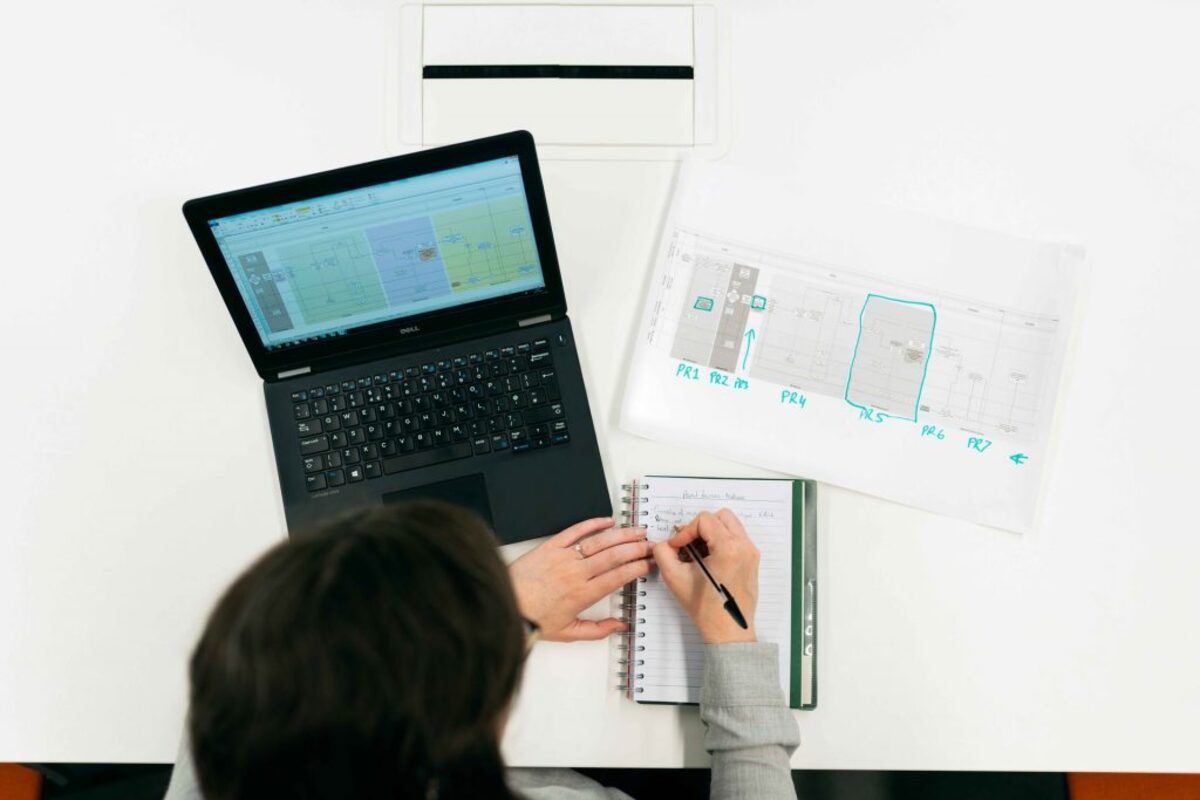 Person working on white desk