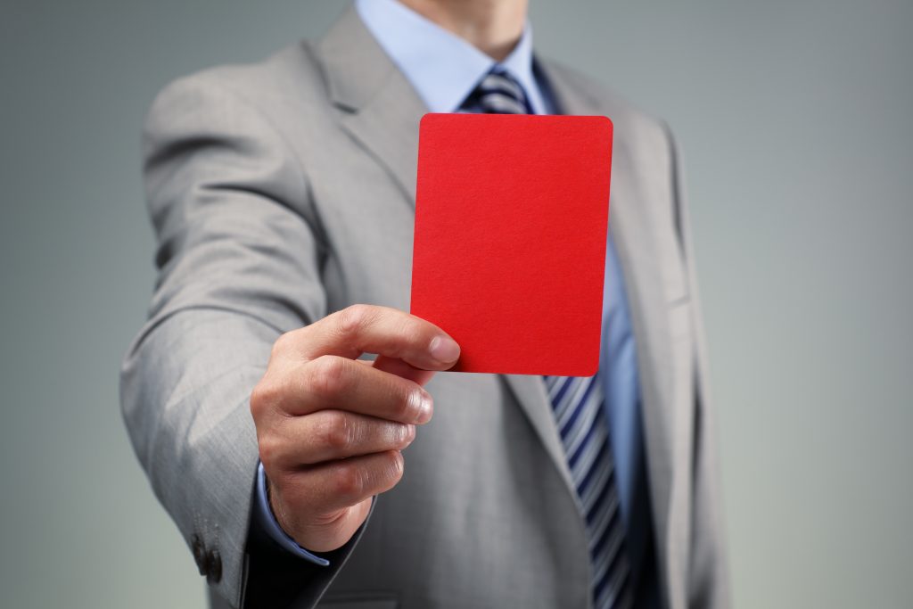 Man holding penalty card