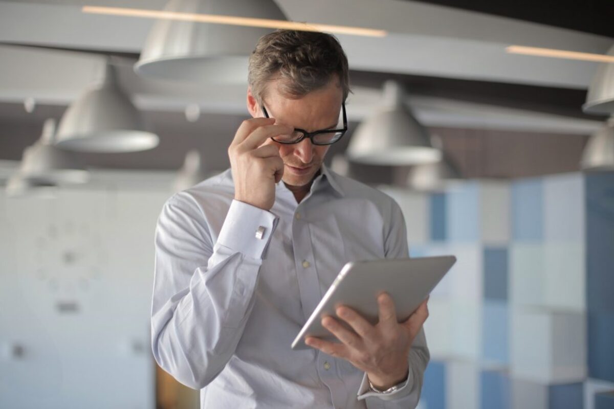 Man reading from tablet