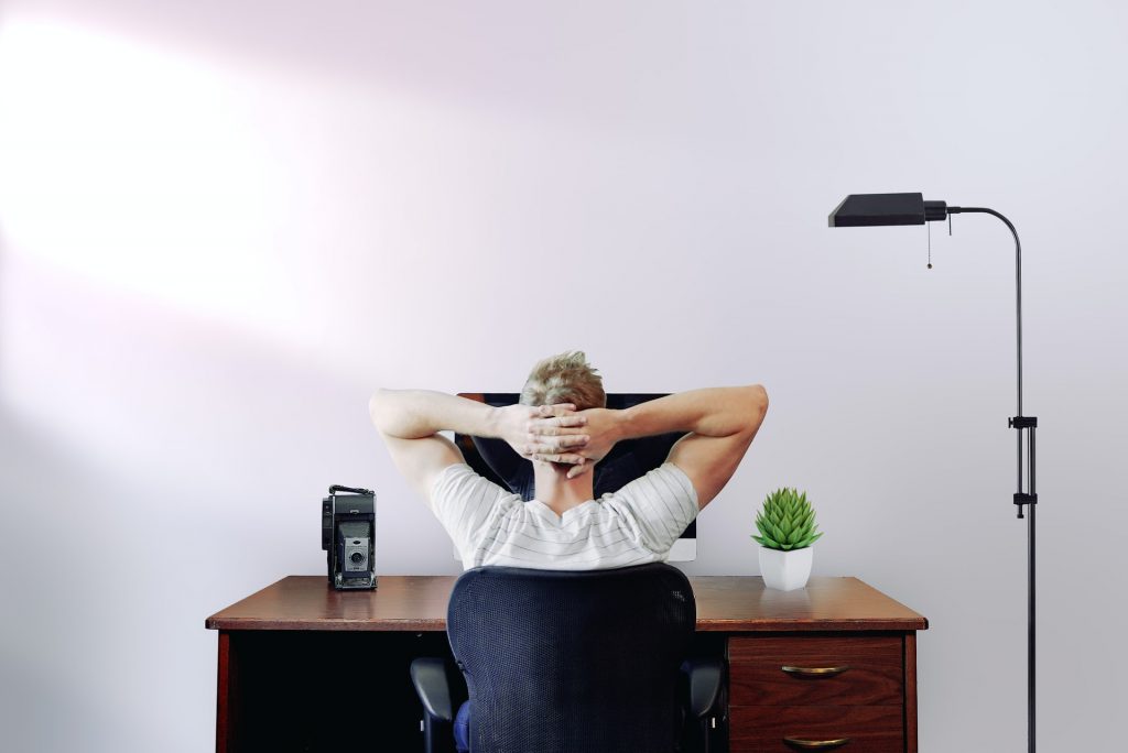 Man sitting at desk thinking