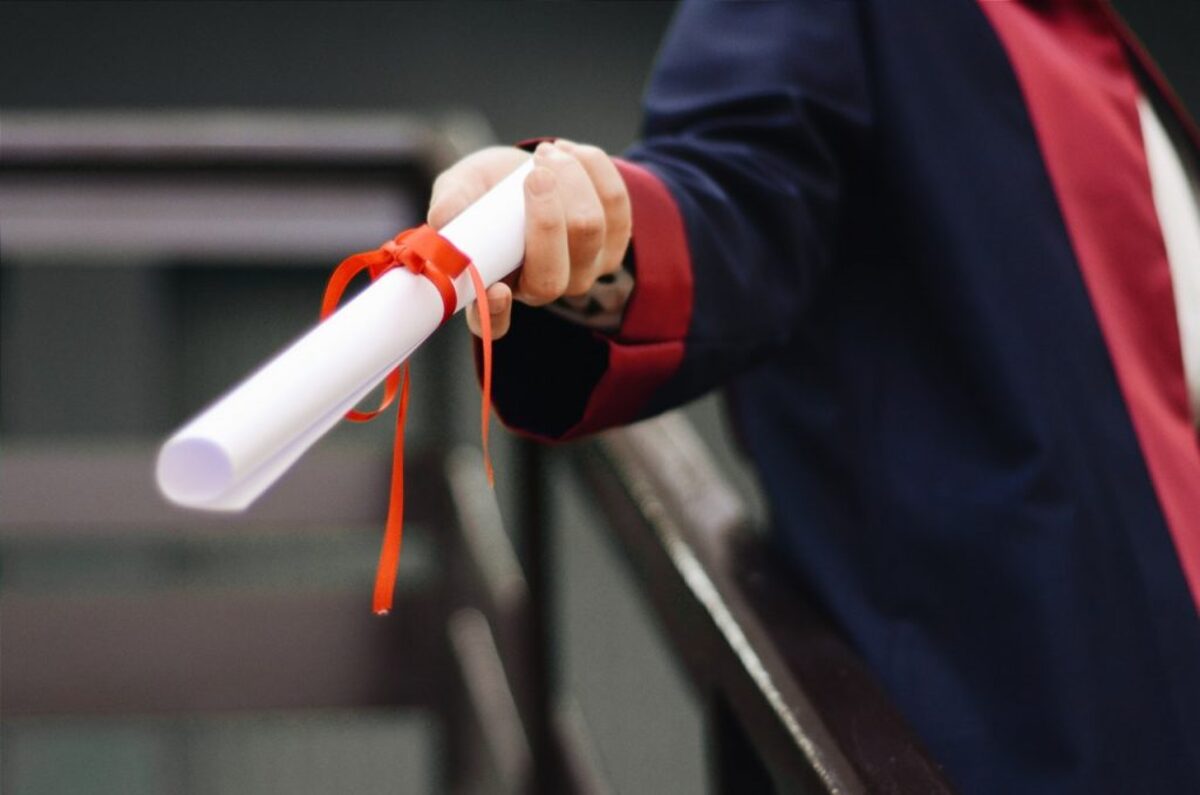 Person holding diploma