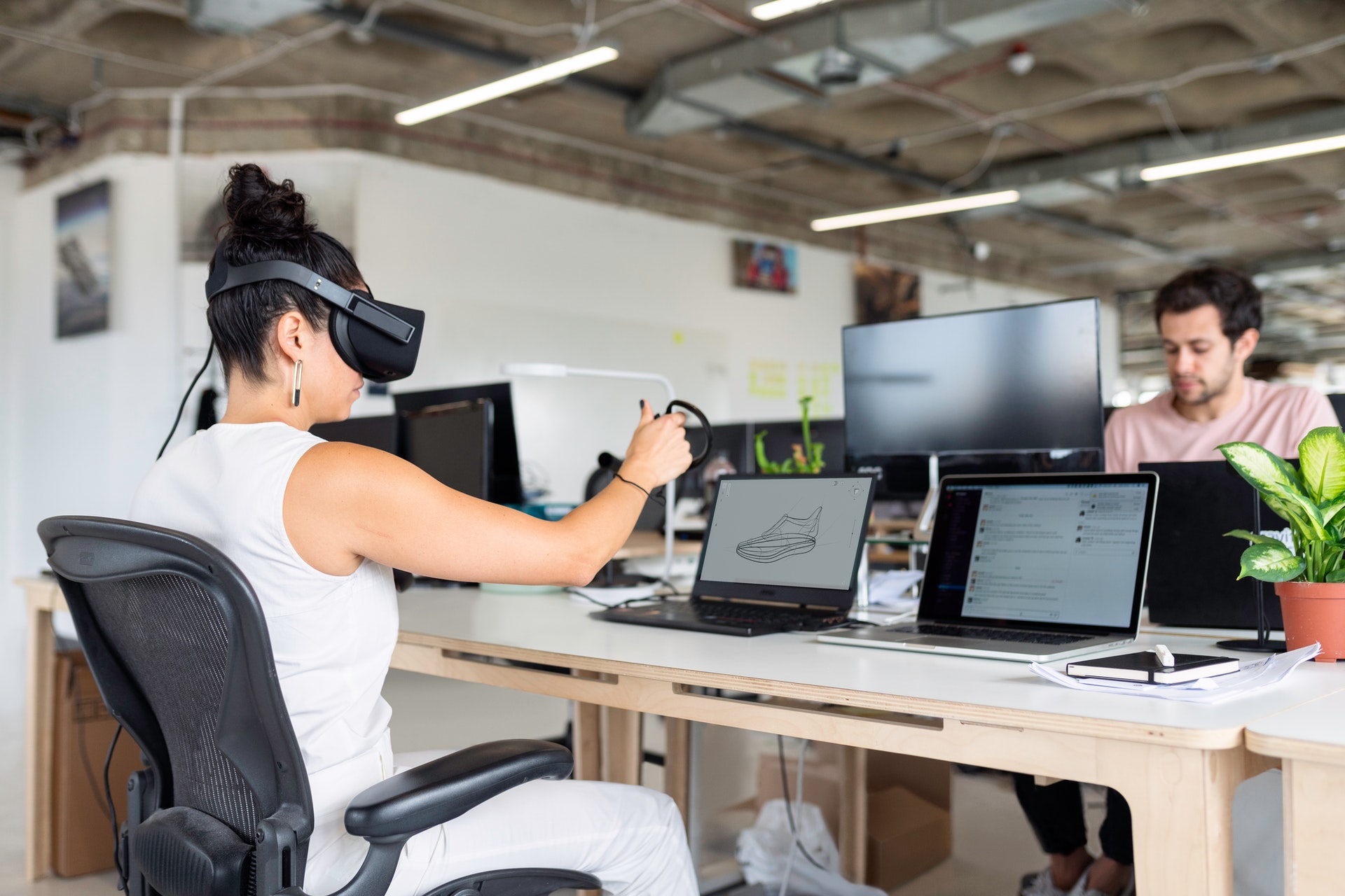 Woman with VR headset in office