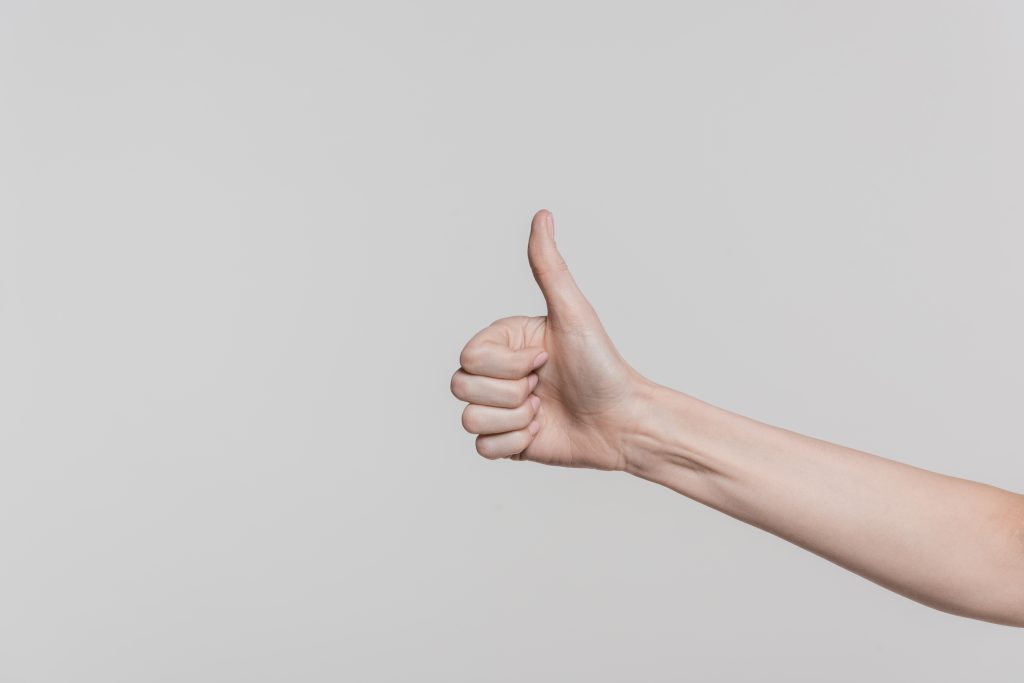 Person showing thumbs up