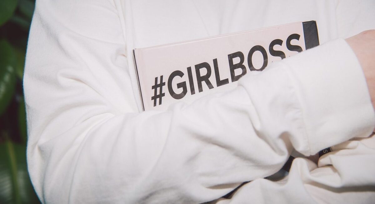 Grl holding hashtag notebook