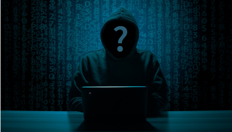Hacker sitting in a room