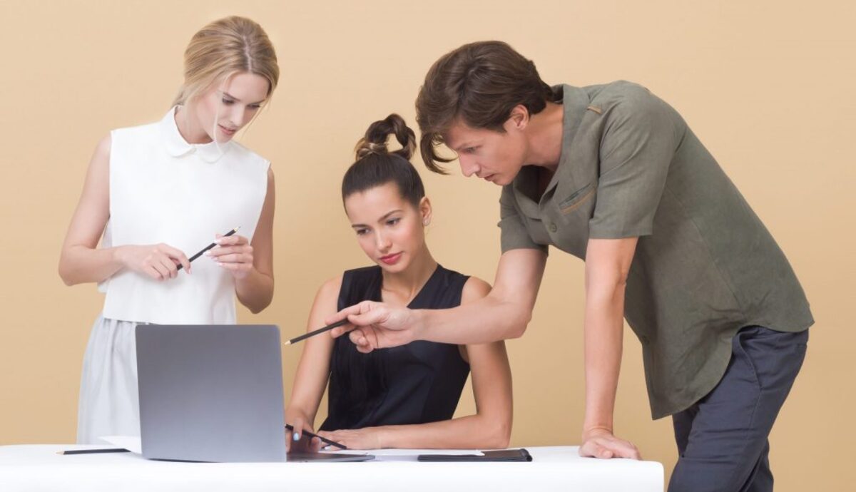 Colleagues looking at laptop