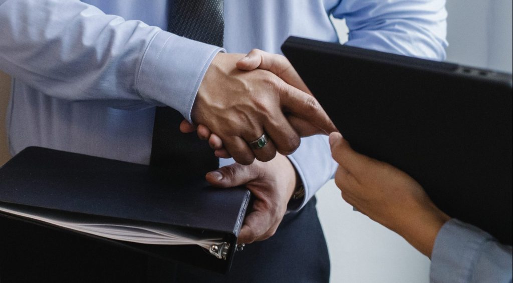 Entrepreneurs shaking hands after agreement