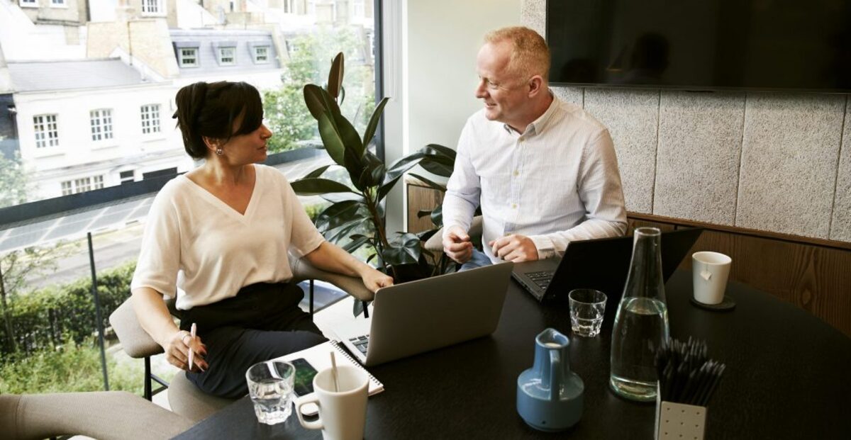 Man and woman discussing and sharing ideas