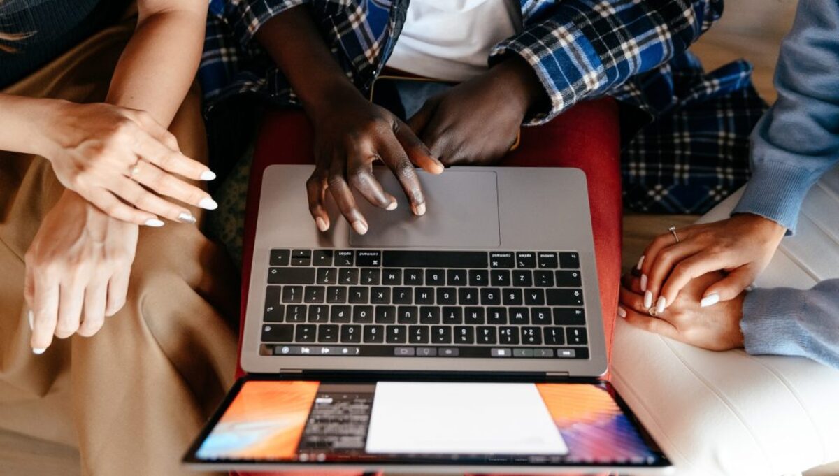 Diverse women chatting online on laptop