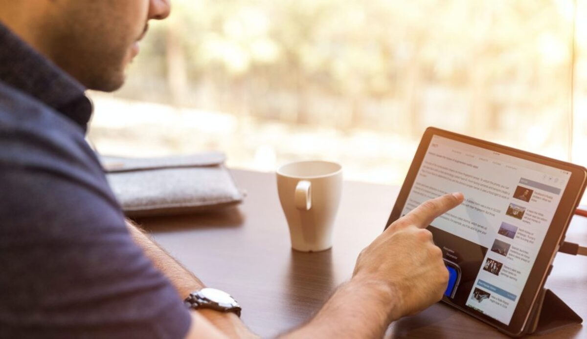 man holding tablet computer