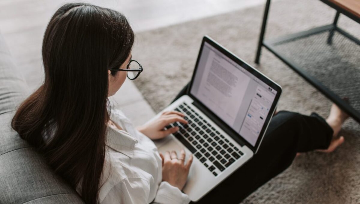 Woman working at home using her laptop