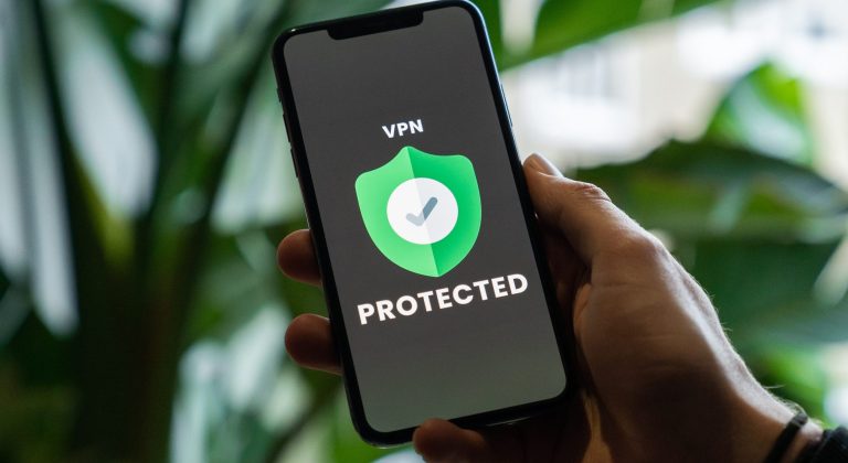 iPhone with VPN service enabled in hand
